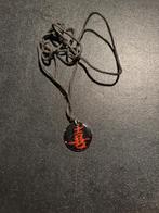 Pendentif par Taizé (Chine), Envoi, Comme neuf, Noir, Croix ou Symbole