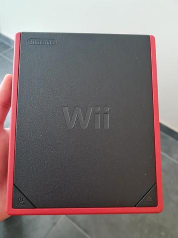 Wii mini met 2 controllers, 3 nunchuks en enkele spelletjes, Games en Spelcomputers, Games | Nintendo Wii, Ophalen of Verzenden