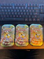 ⭐️ Scarlet & Violet - Prismatic Evolutions Tins ⭐️, Hobby en Vrije tijd, Verzamelkaartspellen | Pokémon, Ophalen of Verzenden