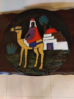 een bord met kameel uit Marrakech, Ophalen