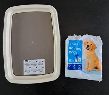 Puppytrainer met pads beschikbaar voor biedingen
