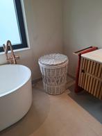 Wasmand in rotan, Ophalen