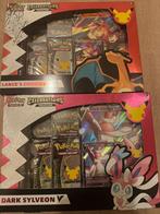 Celebrations pin boxen: lance charizard en dark sylveon, Hobby en Vrije tijd, Verzamelkaartspellen | Pokémon, Ophalen, Nieuw, Foil