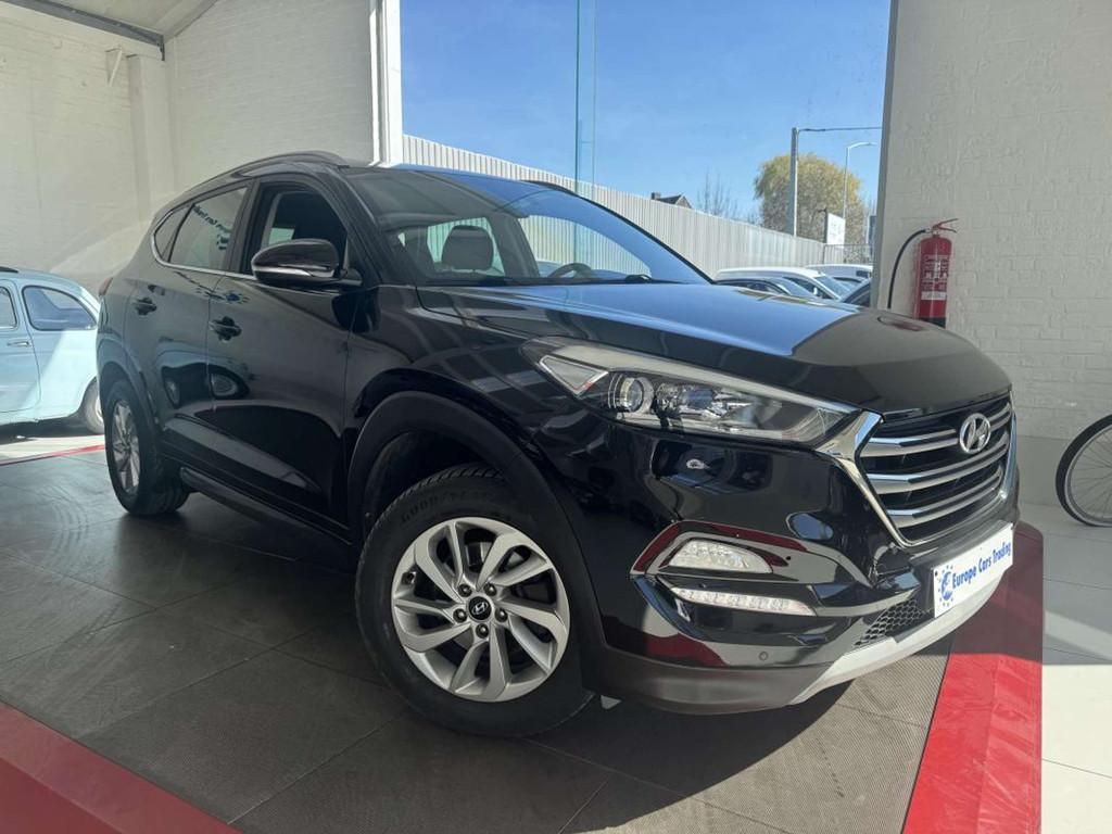 Hyundai Tucson 1.6GDI 132Ch CLIM AUTO CAMERA GAR 12M, Stof, Gebruikt, 1591 cc, Zwart