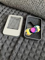 Langwerpige spinner in metalic regenboogkleuren, Kinderen en Baby's, Ophalen of Verzenden