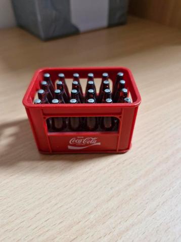 Oude kleine flesopener van Coca-Cola