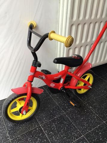 Eerste kinderfietsje met duwstang beschikbaar voor biedingen