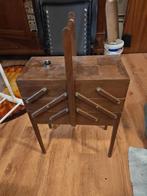 Meuble de couture accordéon, Enlèvement