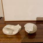 Hand en schelpen potje, Enlèvement