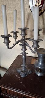 Tinnen kandelaar, Ophalen