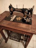 Antieke naaimachine pfaff, Ophalen