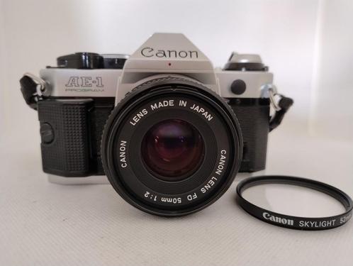 Canon AE1Program Camera met 50mm 1:2 lens en Canon Filter, Audio, Tv en Foto, Fotocamera's Analoog, Zo goed als nieuw, Spiegelreflex