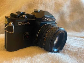 2 Zwarte Chinon CM-4 vintage camera’s te koop beschikbaar voor biedingen