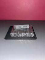 Un paquet de porte-clés Mercedes-Benz, Enlèvement