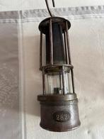 Mijnwerkerslamp., Ophalen