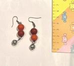 Oorbellen met rode parels, Envoi