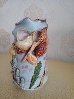 Vaas met schelpen, Ophalen