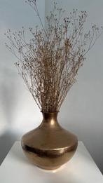 Gouden vaas met decoratie takken, Ophalen