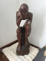 Houten beeld de denker, Ophalen