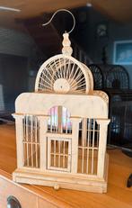 Houten vogelkooi, Ophalen