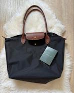 Longchamp tas, Ophalen