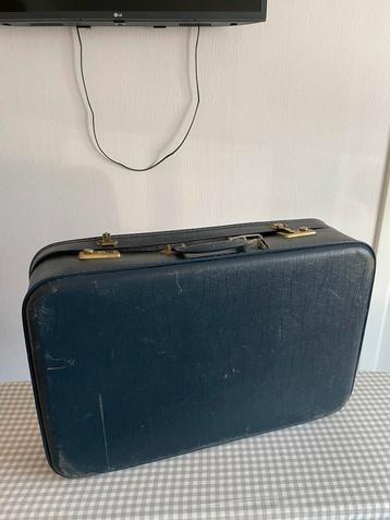 Vintage donkerblauw reiskoffer decoratie beschikbaar voor biedingen