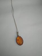 Zilveren ketting met hangertje goudbruin amber, Nieuw, Met edelsteen, Ophalen of Verzenden, Zilver