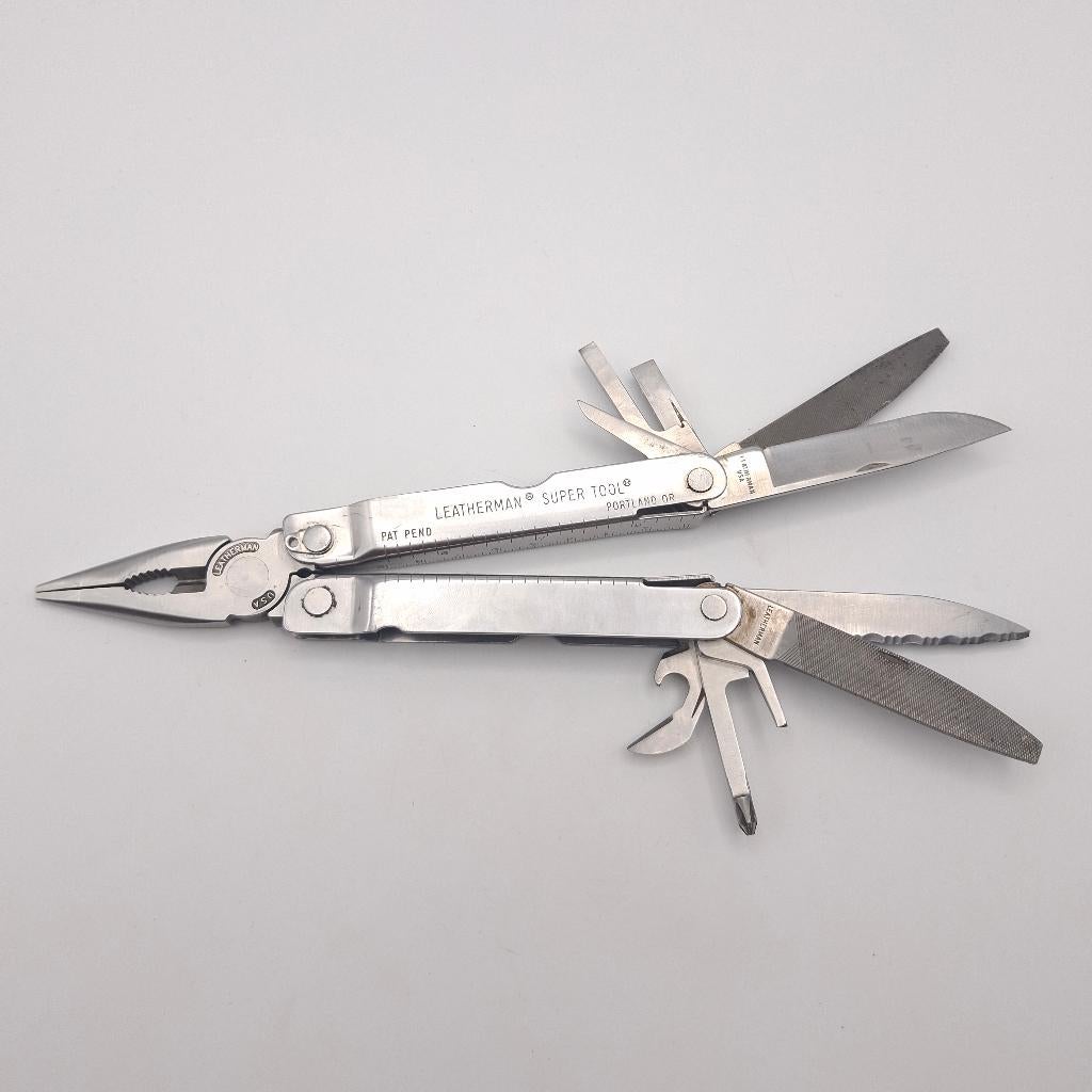 Outil multifonctions Leatherman Super Tool de 1re génération, Caravanes & Camping, Outils de camping, Comme neuf, Enlèvement ou Envoi