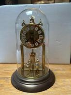 Een vintage roterende torsieslingerklok van Haller., Antiquités & Art, Antiquités | Horloges, Enlèvement
