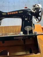 Antiek naaimachien Bobbin, Ophalen