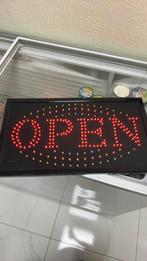 “OPEN” lichtbord, Ophalen