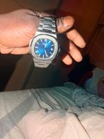 Stalen horloge met blauwe wijzerplaatvan Patek Philippe, Montre-bracelet, Autres marques, Enlèvement ou Envoi, Acier