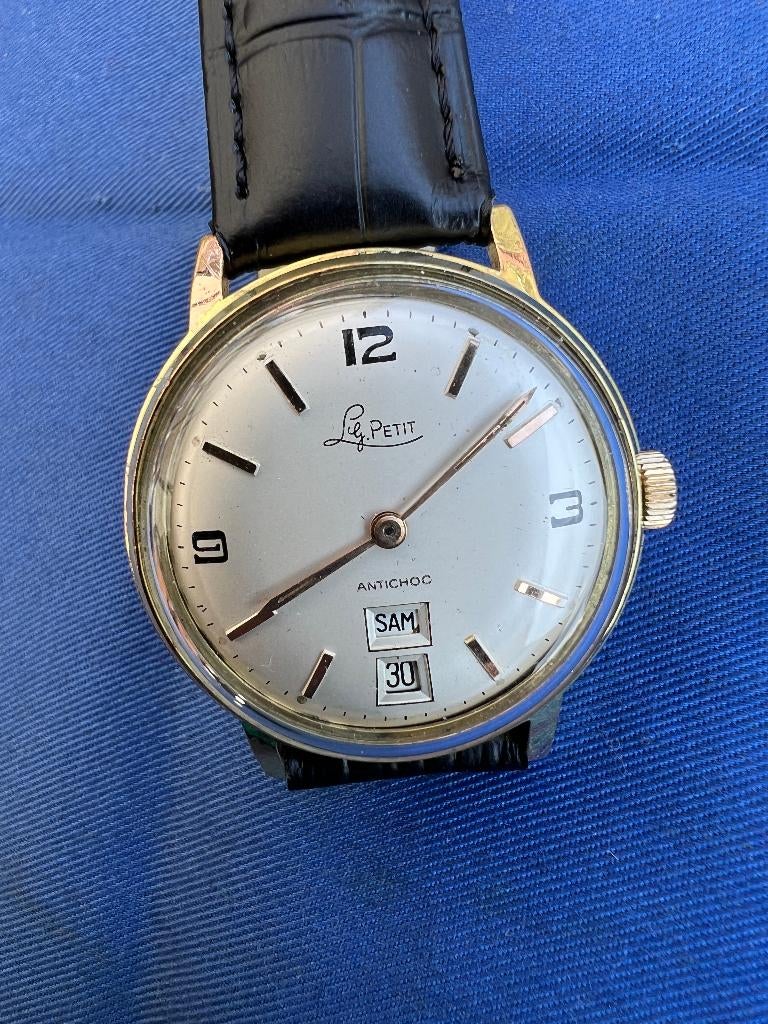 LG Petit Vintage Opwindbaar Herenhorloge, Overige materialen, Leer, Polshorloge, Zo goed als nieuw
