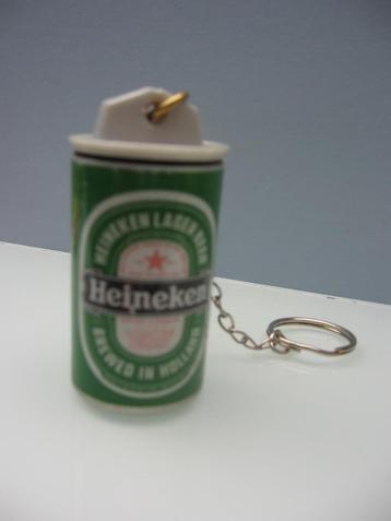 Porte-clé Heineken. Neuf Capsule en plastique pleine avec lé