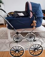 poppenwagen met pop samen, Ophalen