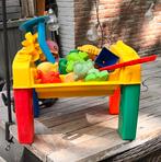 Speeltafel voor zand of water met spulletjes, Ophalen