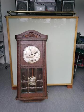 antieke regulator wandklok van Fms, Enlèvement