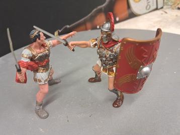 2 strijdende Romeinen en 2 indianen te paard