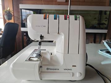 Met garantie! 1maal gebruikt overlocker Husqvarna s100 beschikbaar voor biedingen