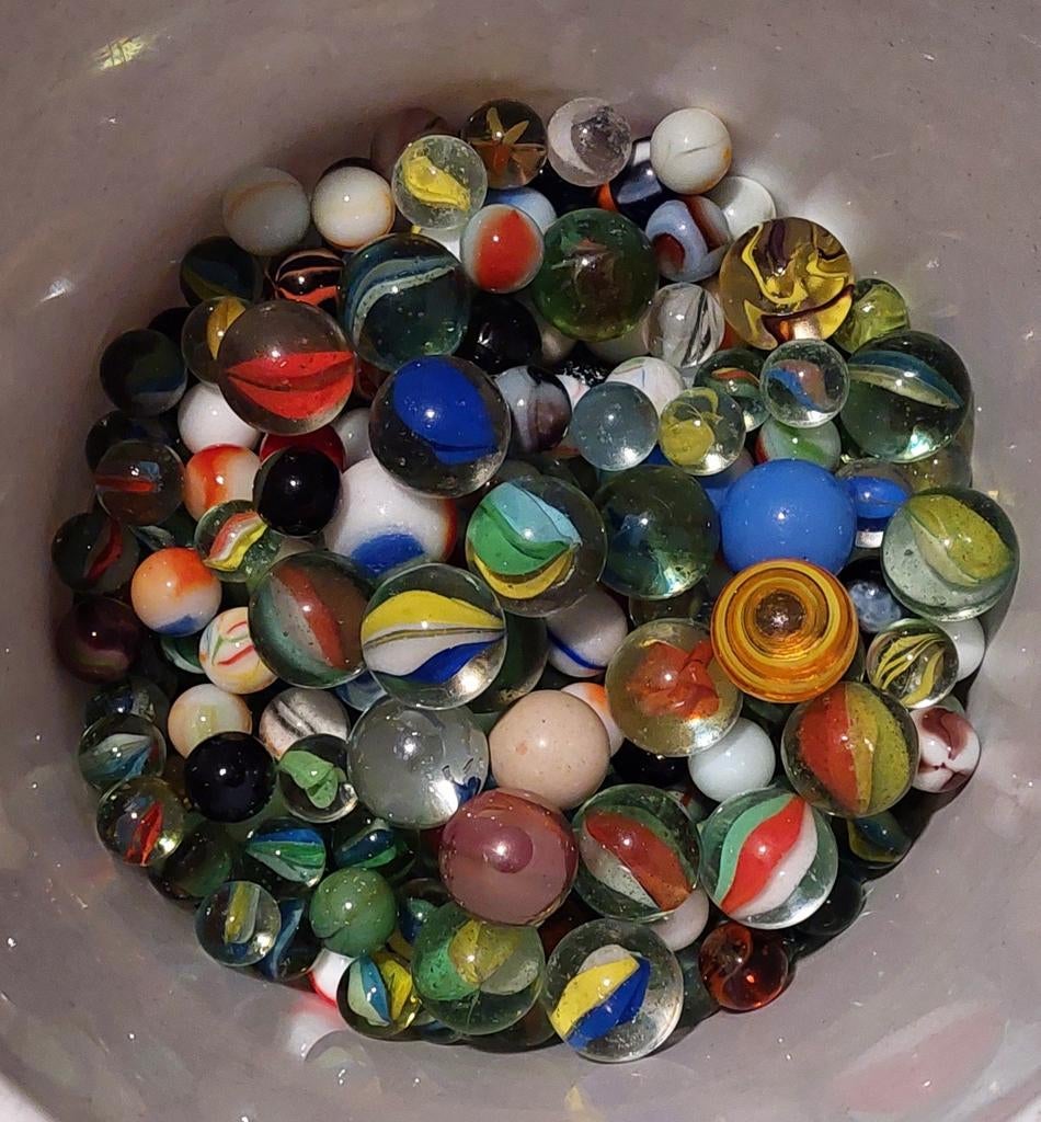 Knikkers: 333 kleine, 25 grote, Ophalen