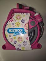 New tuinslang op rol, Ophalen