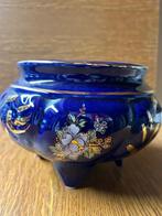 Blauwe keramiek pot, Ophalen