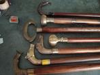 Riet met een pommel van massief messing en rozenhout