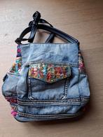 Desigual jeanstas, Ophalen
