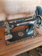 Antieke naaimachine, Ophalen