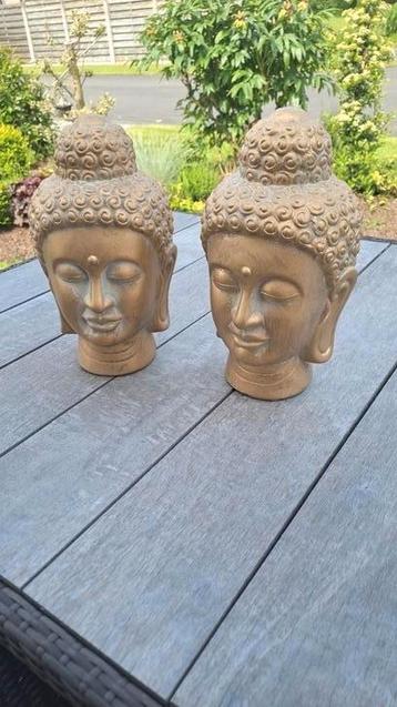 2 Buddhahoofden in mat goud beschikbaar voor biedingen