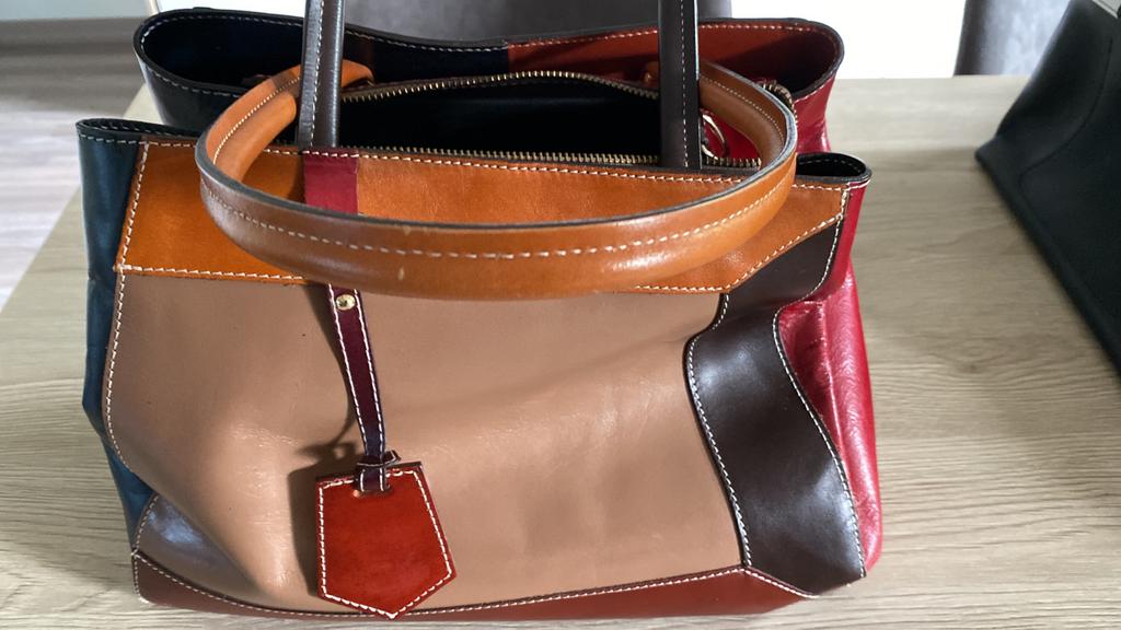 Handtas, Ophalen, Zo goed als nieuw