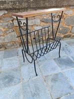 Smeedijzeren krantenhouder, Ophalen