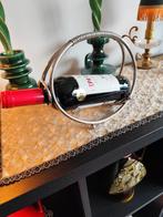 Wijnfleshouder, Ophalen