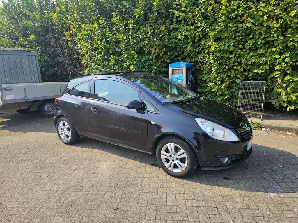 Opel Corsa 1.2 Benzine 2009, 
160000 km., Auto's, Elektrische ramen, Zwart, Handgeschakeld, Particulier